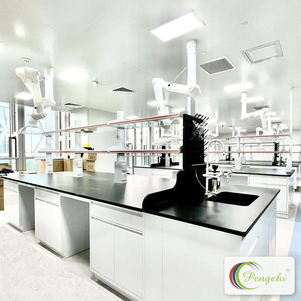 Central laboratory workbench with chemical-resistant black countertop, integrated sink and overhead fume extraction arms installed by Pengchi at Shenzhen Aier Eye Hospital.